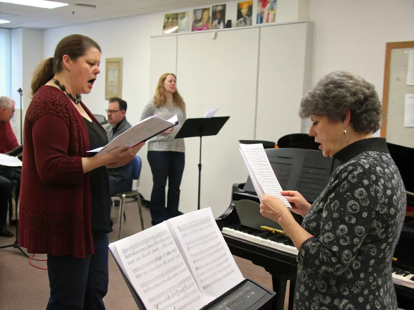 A lively image of a vocal training workshop, featuring students practicing vocal exercises with a coach. The setting is a soundproofed vocal training room at Tinglescroll Music Centre.